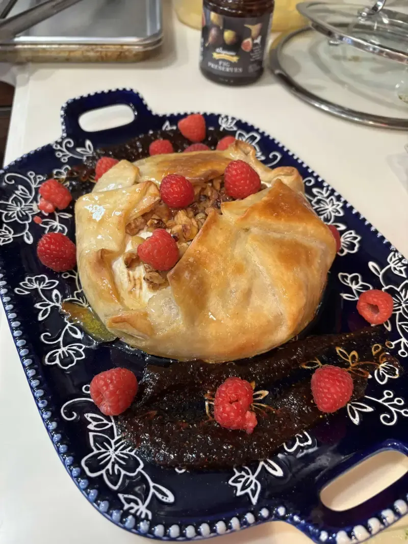 Baked brie en croûte with walnuts and fig preserves for in-home dining