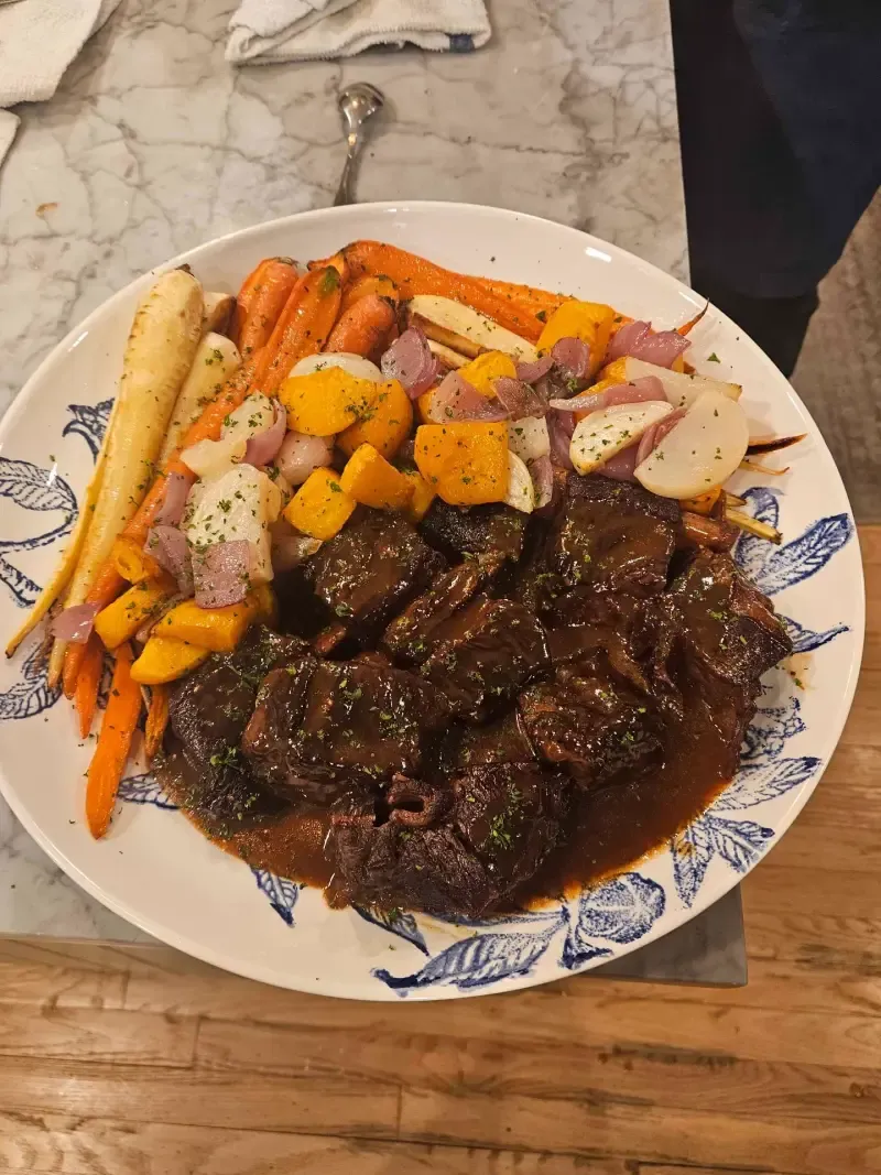 Red wine braised short rib platter with roasted root vegetables